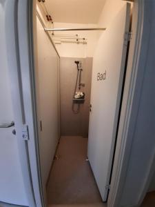 a hallway with a bad sign on the door at Private Room in a shared apartment in Odense