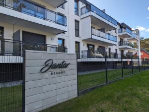 a building with a sign that reads veridian resort at JANTAR RESORT Apartamenty PIAMOLA in Jantar