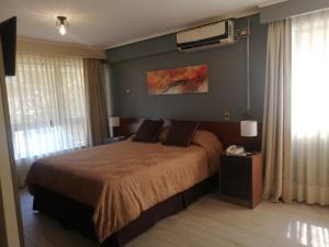 Postel nebo postele na pokoji v ubytování Hotel Diego de Velazquez
