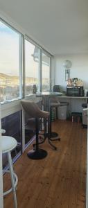 an office with two chairs and a table and windows at port de fecamp in Fécamp +14 photos