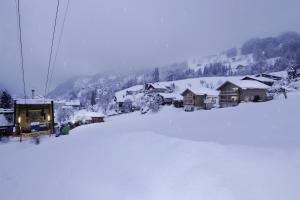 a ski resort covered in snow with a ski lift at Appartments Urmonti in Schruns