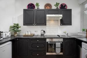 A kitchen or kitchenette at Hornby Apartments