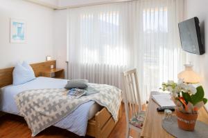 Hotel Rondinella Locarno客房内的一张或多张床位