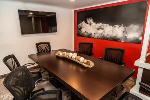 a conference room with a table and chairs at Gamma Puebla Señorial Centro in Puebla