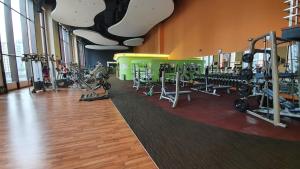 a gym with lots of treadmills and machines at Ayan Service Suite At Times Square in Kuala Lumpur