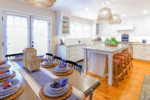 a kitchen with a table with hats on it at Sea Lyon in Nantucket