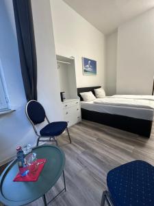 Postel nebo postele na pokoji v ubytování Hotel Astor