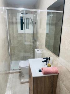 a bathroom with a toilet and a sink and a shower at LOVELY APARTMENT Barca 2 in Barcelona