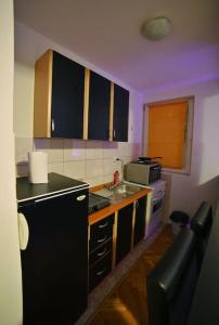 Kuchyň nebo kuchyňský kout v ubytování Neo Apartment