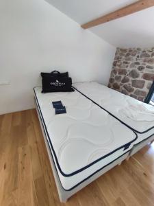 Posteľ alebo postele v izbe v ubytovaní L'atelier des huppes