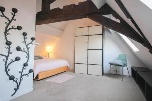 Giường trong phòng chung tại Charming 60m2 apartment