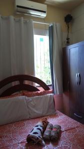 a group of shoes laying on a bed at Beach House in Salinas da Margarida