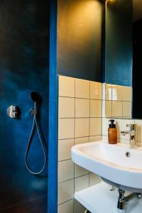 a bathroom with a sink and a shower at Villa Westland in Koksijde +60 photos