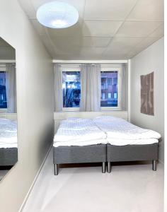 Un pat sau paturi într-o cameră la Nomad Gardet