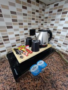 a table with a coffee maker and a coffee pot on it at HERMES OTEL in Edirne