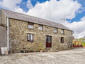 an old stone house with a brick at 2 bed property in Brynteg West Wales 81353 in Llanwenog
