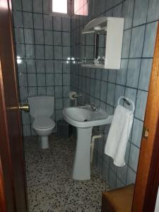 a bathroom with a sink and a toilet at can tica in Bocairent
