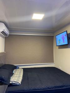 TV i/ili multimedijalni sistem u objektu Container Home Py