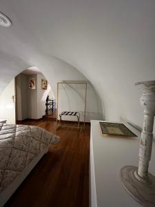 a bedroom with a bed and a table at Calefati Gallery Luxury Apartment in Bari