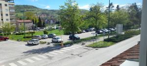 arial view of a parking lot with cars parked at Aura City 2 in Visoko