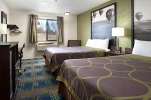 a hotel room with two beds and a window at SureStay by Best Western Walla Walla in Walla Walla +34 photos
