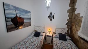 Postel nebo postele na pokoji v ubytování GIJÓN MARINO