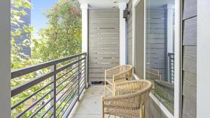 two wicker chairs sitting on a balcony at Landing Modern Apartment with Amazing Amenities (ID1011X798) in San Antonio