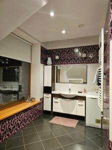 a large kitchen with a sink and a counter at Jeruzale Park view in Vilnius