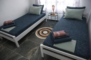 Ένα ή περισσότερα κρεβάτια σε δωμάτιο στο SUN'S HOUSE