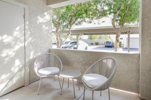 two chairs and a table on a balcony at Landing Modern Apartment with Amazing Amenities (ID4278) in Anthem