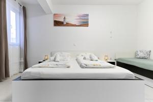 Posteľ alebo postele v izbe v ubytovaní Apartments Villa Visnjik