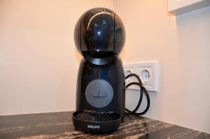 a black blender sitting on top of a counter at Benalbeach Zafiro by C&N in Benalmádena