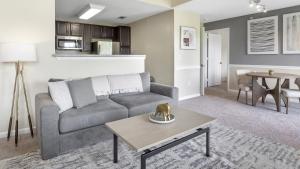 a living room with a couch and a table at Landing Modern Apartment with Amazing Amenities (ID7856X82) in Midlothian