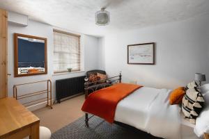 a bedroom with a large bed and a window at Parade Watch in Bath