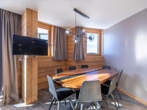 a dining room with a wooden table and chairs at Appartement Avoriaz, 4 pièces, 8 personnes - FR-1-314-129 in Avoriaz