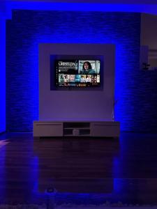 Et tv og/eller underholdning på Riaho Apartment