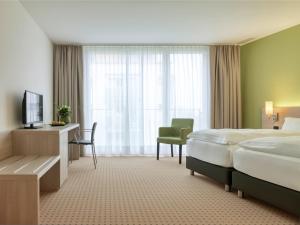 Televiisor ja/või meelelahutuskeskus majutusasutuses Hotel Eastside (free parking garage)