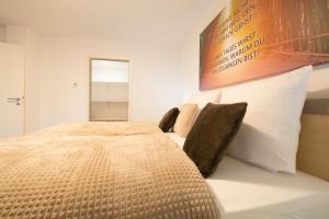 a bedroom with a large bed and a mirror at Luxury Kirrberg in Homburg