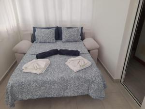 a bed with two white towels on top of it at Villa Atlántica - Heated pool in Playa Blanca in Playa Blanca