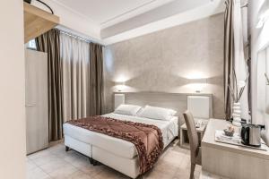 Postel nebo postele na pokoji v ubytování Artemisia Palace Hotel