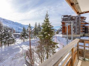 a view from the balcony of a building in the snow at Studio Avoriaz, 1 pièce, 4 personnes - FR-1-314-216 in Morzine