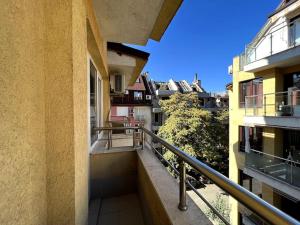an apartment balcony with a view of a city at Lovely 2-bedroom rental unit in Sofia in Sofia