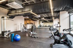 a gym with several treadmills and exercise bikes at ULIV Cibeles in Mexico City