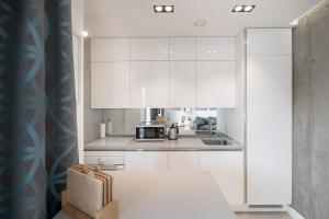 Η κουζίνα ή μικρή κουζίνα στο Fortuna Apartament z parkingiem