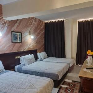 Кровать или кровати в номере Regency Lodge Resort