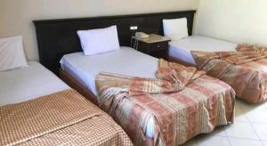 Кровать или кровати в номере Regency Lodge Resort