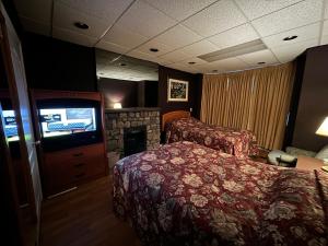 a hotel room with a bed and a television at Nox Hostel in Toronto