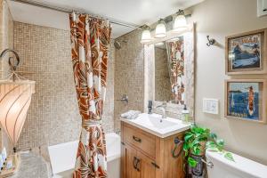 a bathroom with a sink and a tub and a shower at Retro El Sobrante Apartment Near San Francisco! in El Sobrante +18 photos