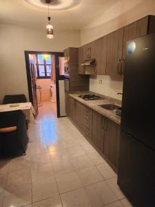 A kitchen or kitchenette at Aprt 4 Family
