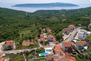 an aerial view of a village with houses and a lake at Villa Zaria by Briskva in Mošćenička Draga